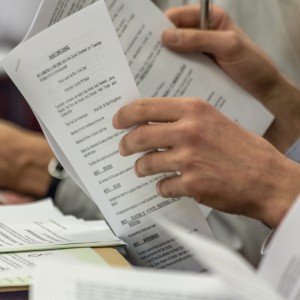 Image of Council documents being read - to represent a Council meeting