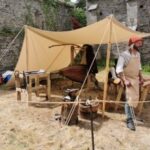 Grey Goose Workshop - Blacksmith, Leatherworker and Travelling Forge Man at tent with travelling forge