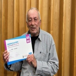Liskeard in Bloom volunteer with award certificate